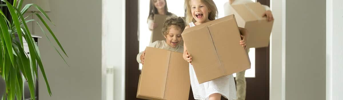 Kids running down the hall with moving boxes Bergan & Company Property Management Denver, Centennial, Colorado